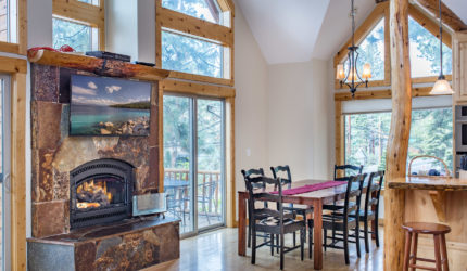 View of Dining Room stone fireplace with tv above the fire place at North Lake Blvd
